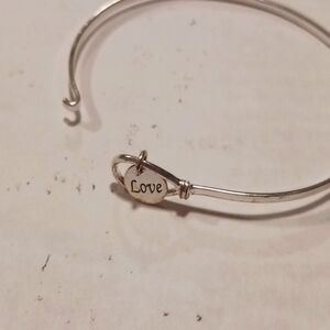 Sterling silver bracelet with small charm inscribed with Love on one side